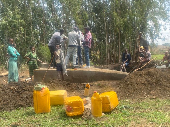 Contractors gather around water source