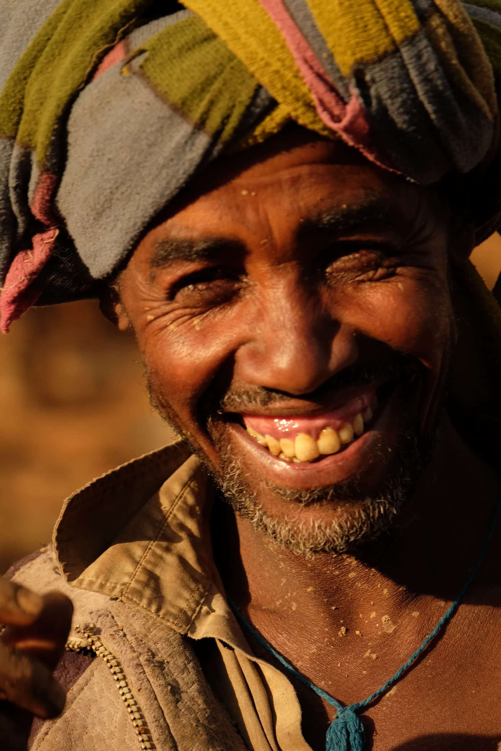 Happy man smiles at camera