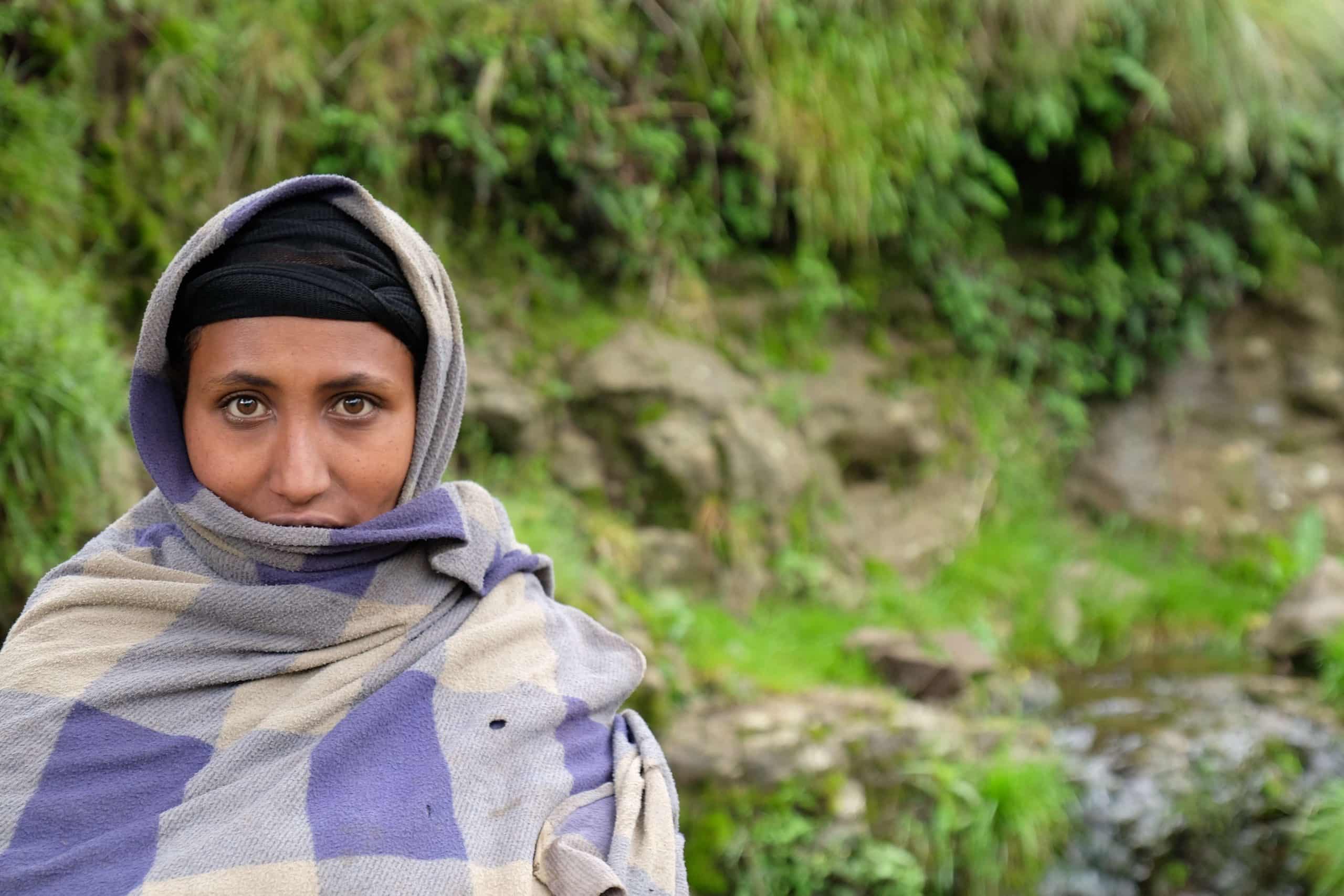 Women in front of stream